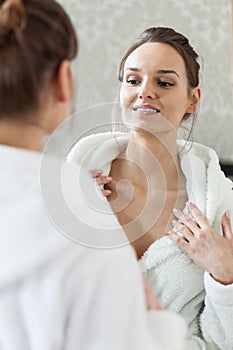 Woman watching results of a skin treatments