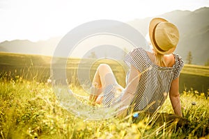 Woman watching the sunset. Serenity and relaxation.