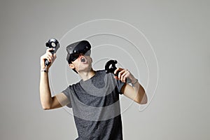 Woman Watching Television Wearing Virtual Reality Headset photo