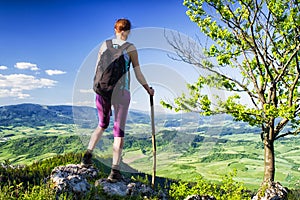 Woman watching from top of the hill, Slovakia