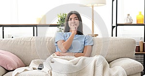 Woman watching tv at home