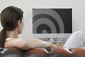 Woman Watching TV In Living Room photo