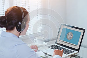 Woman watching video tutorial on computer, business education online