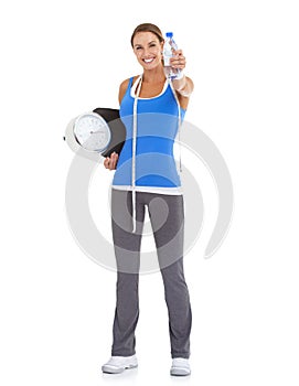 Woman, water bottle and scale for diet, nutrition and health with exercise, workout or results in studio. Portrait of