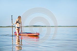Woman in the water with paddleboard