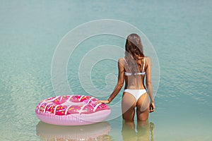 Woman in the Water with a Rubber Ring.