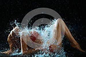 Woman And Water Splash In Dark