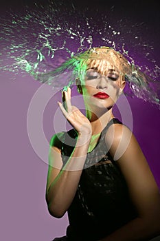 Woman With Water Splashing Onto Her Head in the Shape of Hair