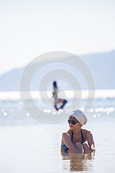 Woman in water trying to cool down