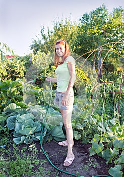 Woman watering garden