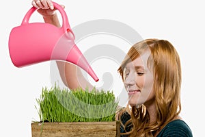 Woman watering grass