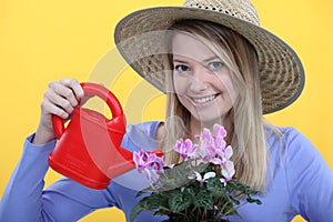 Woman watering her flowers.