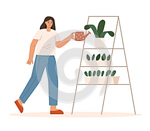 Woman watering potted plant from watering can