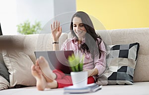 Woman wave hello, talk to friend via video call, happy to hear you