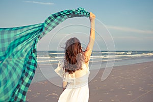 Woman with waver cloth on beach