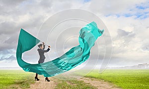 Woman waving blue flag