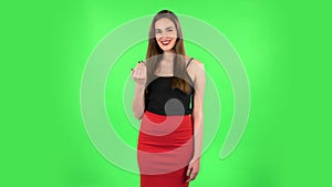 Woman waving hand and showing gesture come here. Green screen