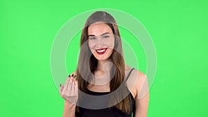 Woman waving hand and showing gesture come here. Green screen