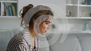 Woman waving having video call at home closeup. Happy smiling lady talk online.