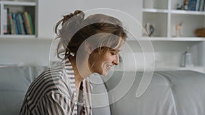 Woman waving having video call at home closeup. Happy smiling lady talk online.