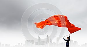 Woman waving red flag