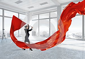 Woman waving red flag