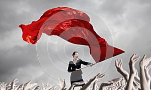 Woman waving red flag
