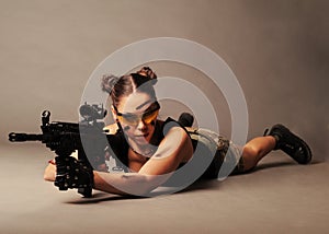Woman with weapon. photo