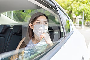 Woman wear mask in car