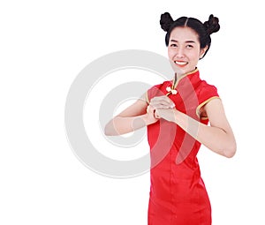 woman wear red cheongsam with gesture of congratulation in concept of happy chinese new year