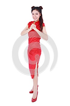 woman wear red cheongsam with gesture of congratulation in concept of happy chinese new year isolated on white background