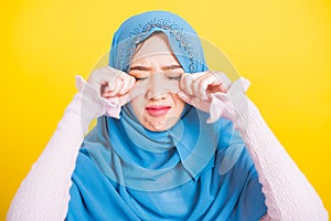 Woman wear veil hijab she sad crying using hand wiping tears in her eyes
