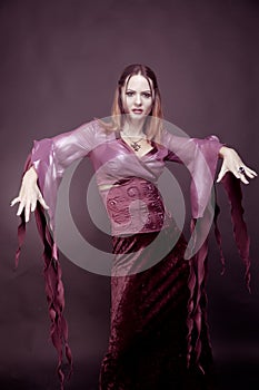 Woman wearing as vampire dancing . Halloween