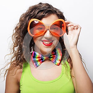 woman wearing big bright sunglasses