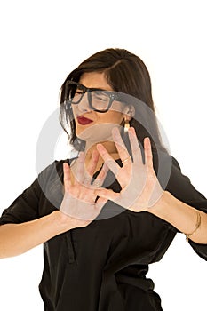 Woman wearing black glasses pushing hands away eyes closed