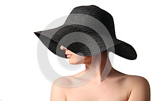 Woman wearing black straw hat