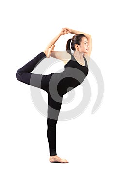 Woman wearing black yoga suit standing pose isolated white