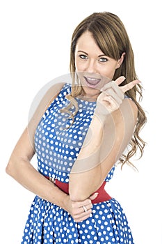 Woman Wearing Blue Polka Dot Dress Pointing Laughing