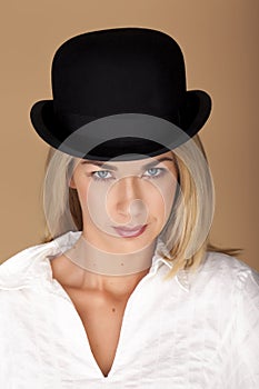 Woman wearing a bowler hat.