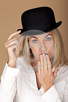 Woman wearing a bowler hat.