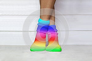 Woman wearing bright rainbow coloured socks