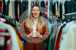 Woman Wearing a brown Overcoat in a Fashion Boutique Store