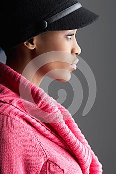 Woman Wearing Cap And Knitwear In Studio photo