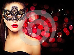 Woman wearing carnival mask photo