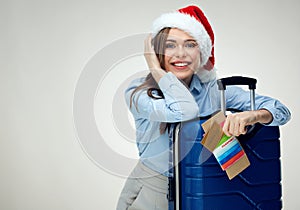 Woman wearing Christmas Santa hat holding credit payment card, p