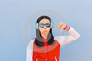 Woman Wearing College Style Jacket Listening to Music
