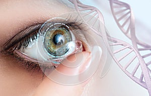 Woman wearing contact lens among DNA stems.