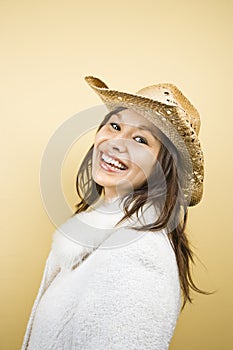 Woman wearing cowboy hat.