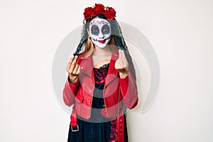 Woman wearing day of the dead costume over white doing money gesture with hands, asking for salary payment, millionaire business