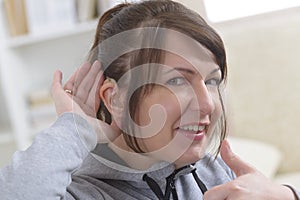 Woman wearing deaf aid